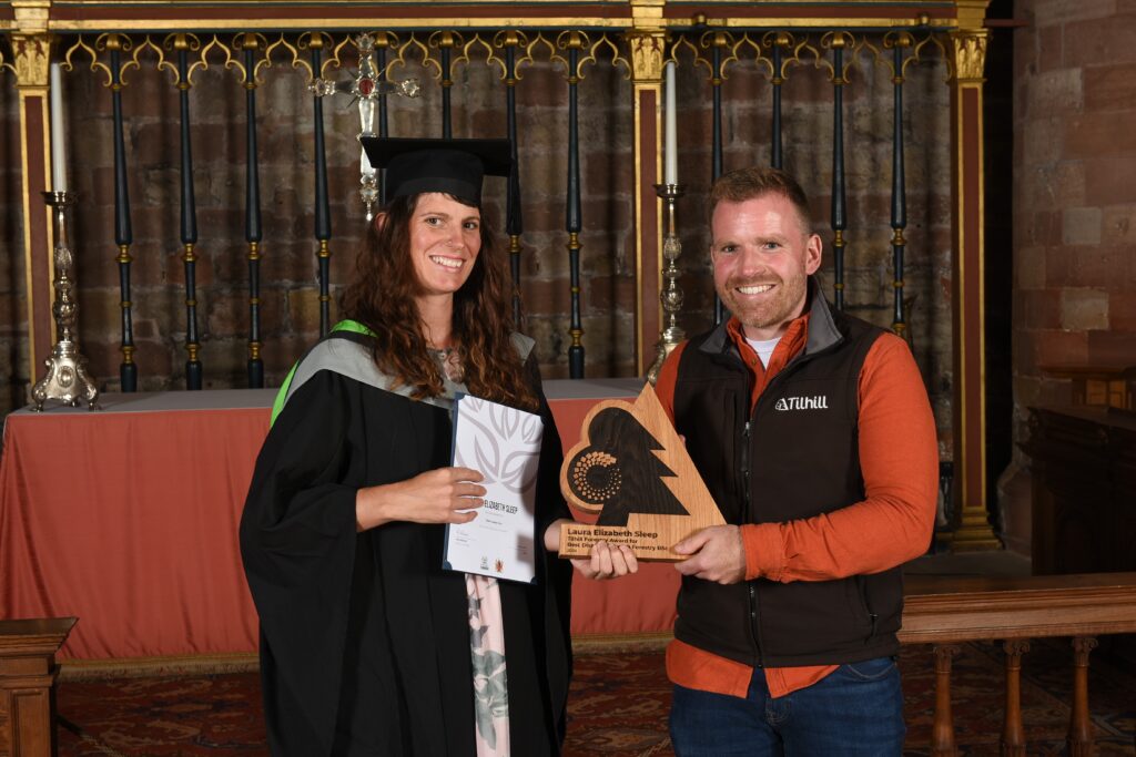 Lulu Sleep from Cumbria University receiving the Tilhill Forestry Award from James Harrison-Moore at university award ceremony.